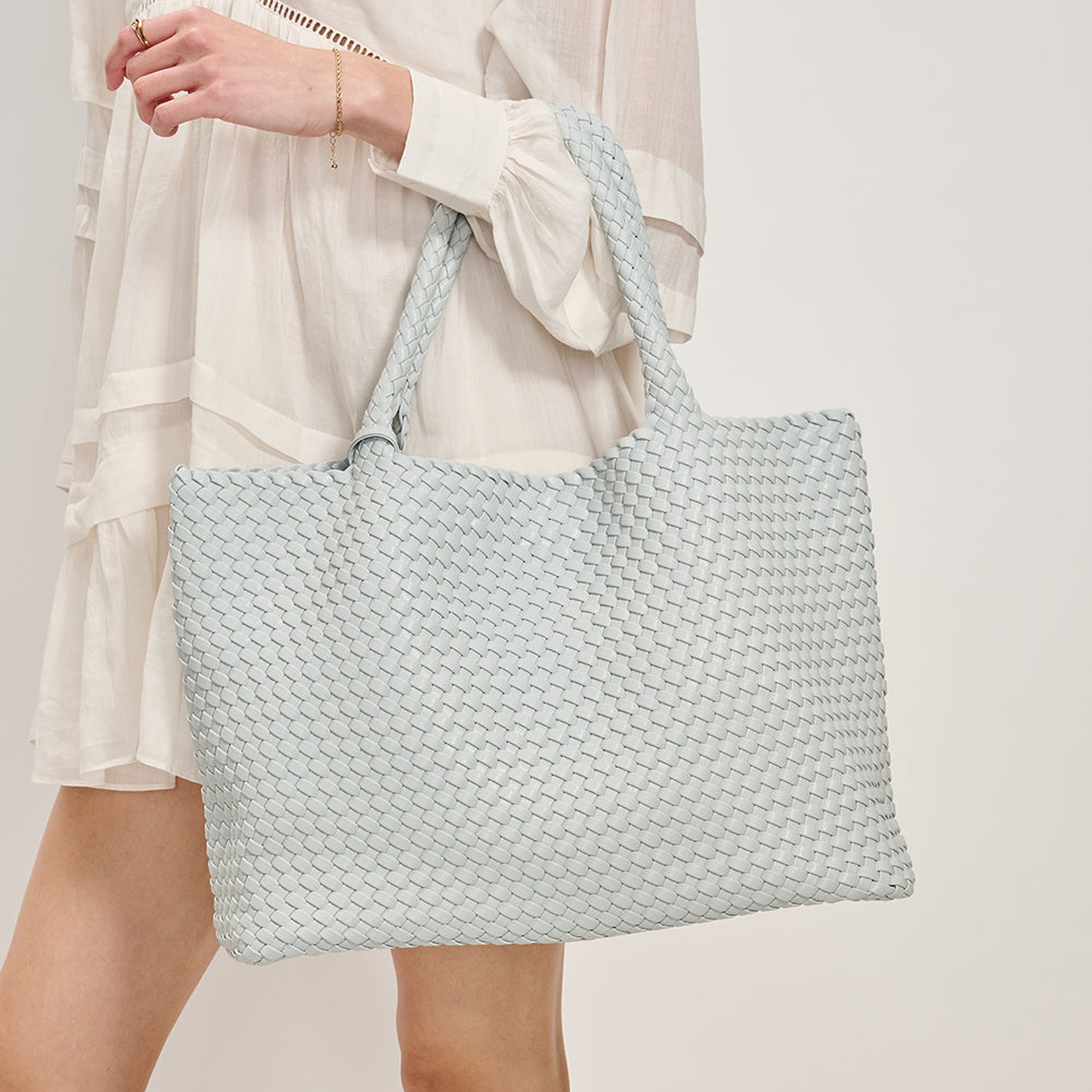 Woman wearing Moda Luxe Solana Tote 842017135760 View 1 | Ice Blue