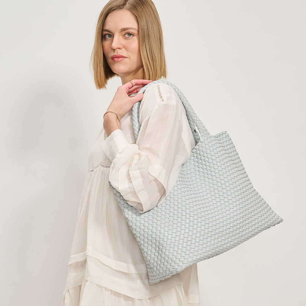 Woman wearing Moda Luxe Solana Tote 842017135760 View 2 | Ice Blue