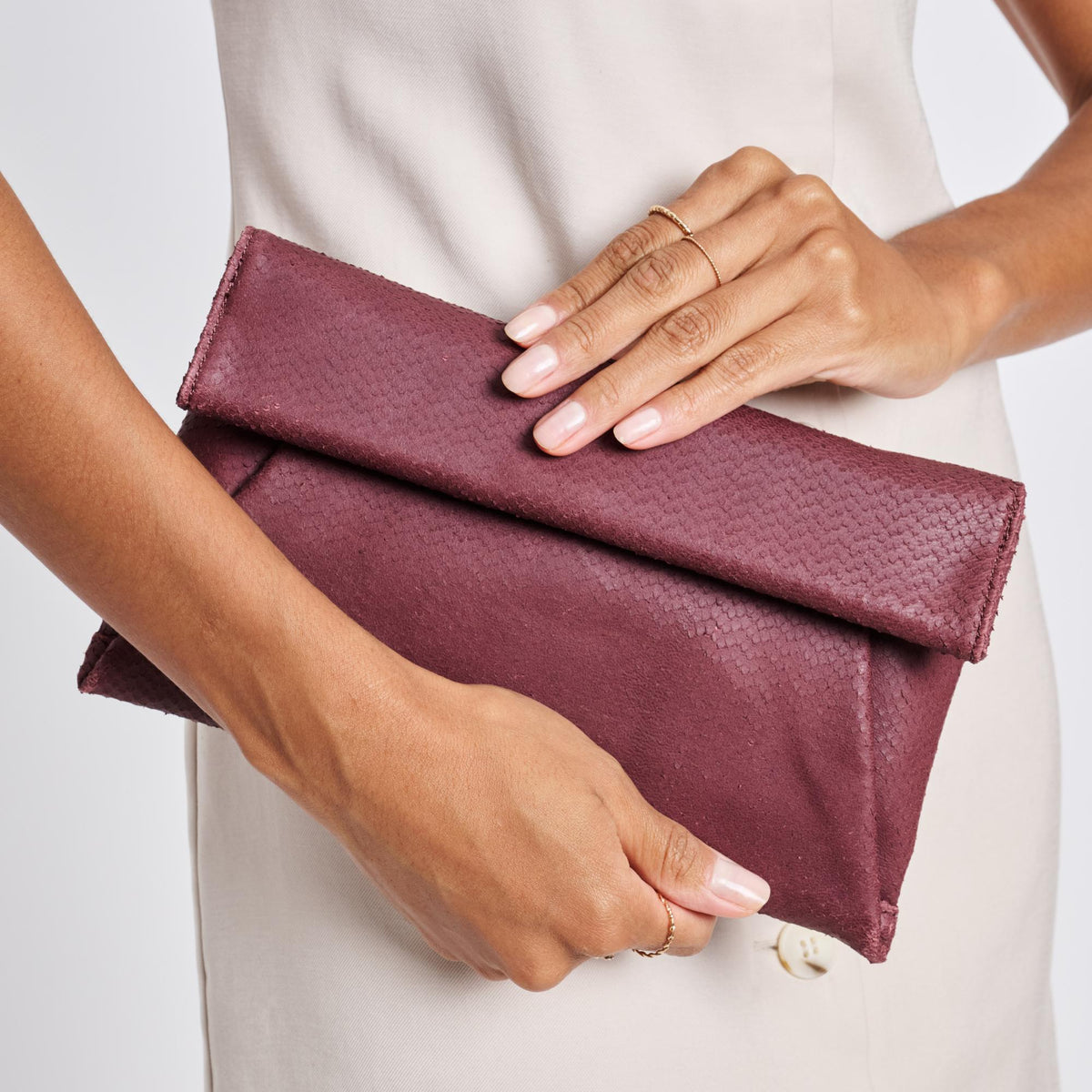 Woman wearing Burgundy Moda Luxe Audrey Clutch 842017118114 View 1 | Burgundy