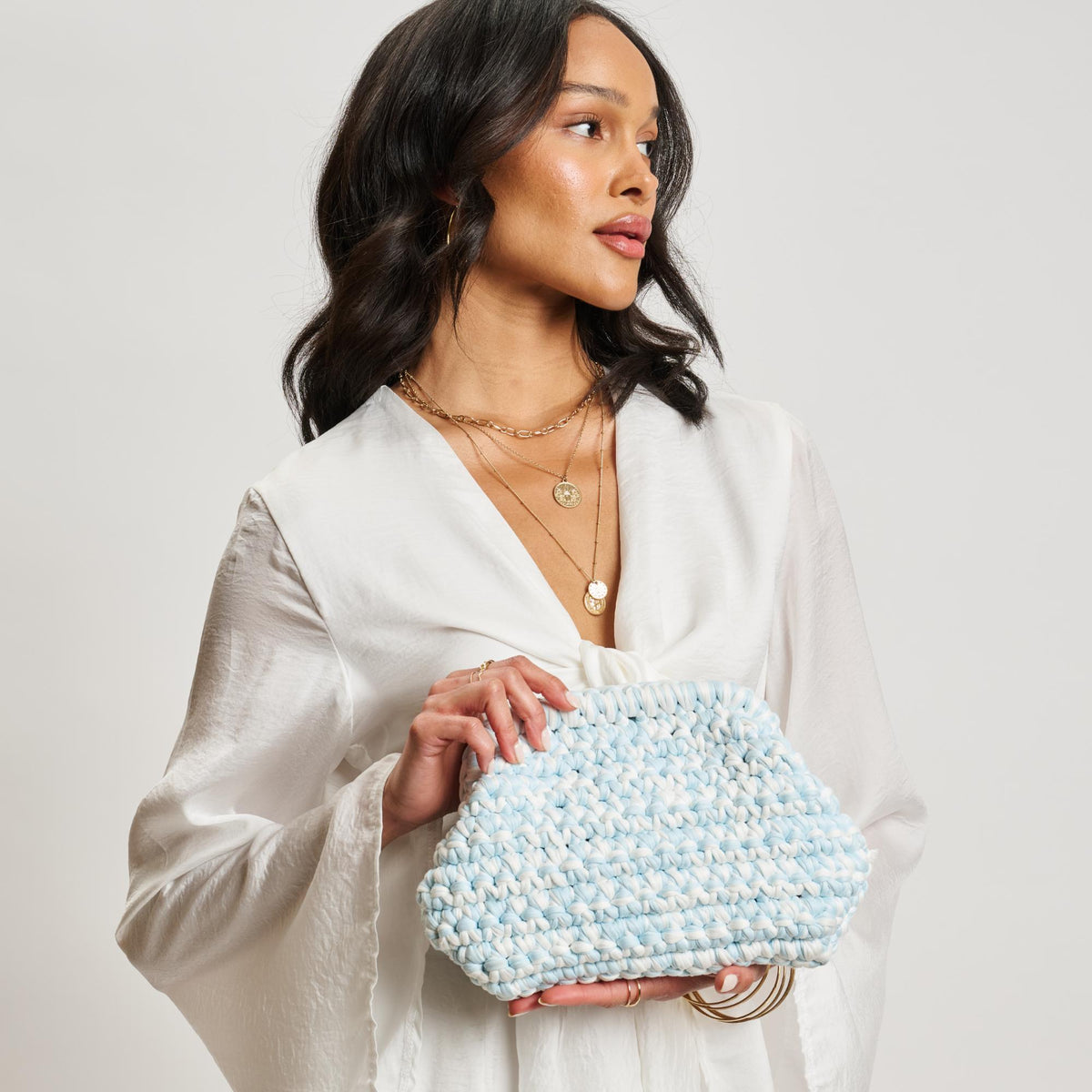 Woman wearing Ice Blue Moda Luxe Raya Clutch 842017138396 View 4 | Ice Blue