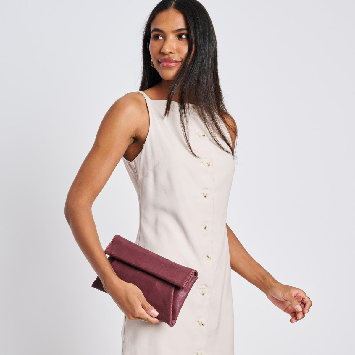 Woman wearing Burgundy Moda Luxe Audrey Clutch 842017118114 View 2 | Burgundy