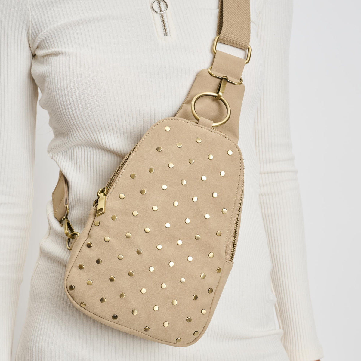 Woman wearing Natural Moda Luxe Regina Studded Sling Backpack 842017136828 View 1 | Natural