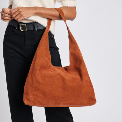 Woman wearing Tan Moda Luxe Amber Hobo 842017137061 View 1 | Tan