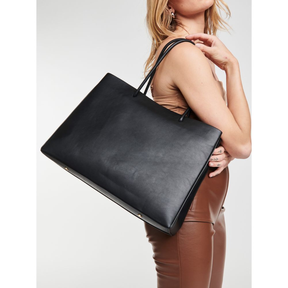 Woman wearing Black Moda Luxe Pierce Tote 842017125037 View 1 | Black