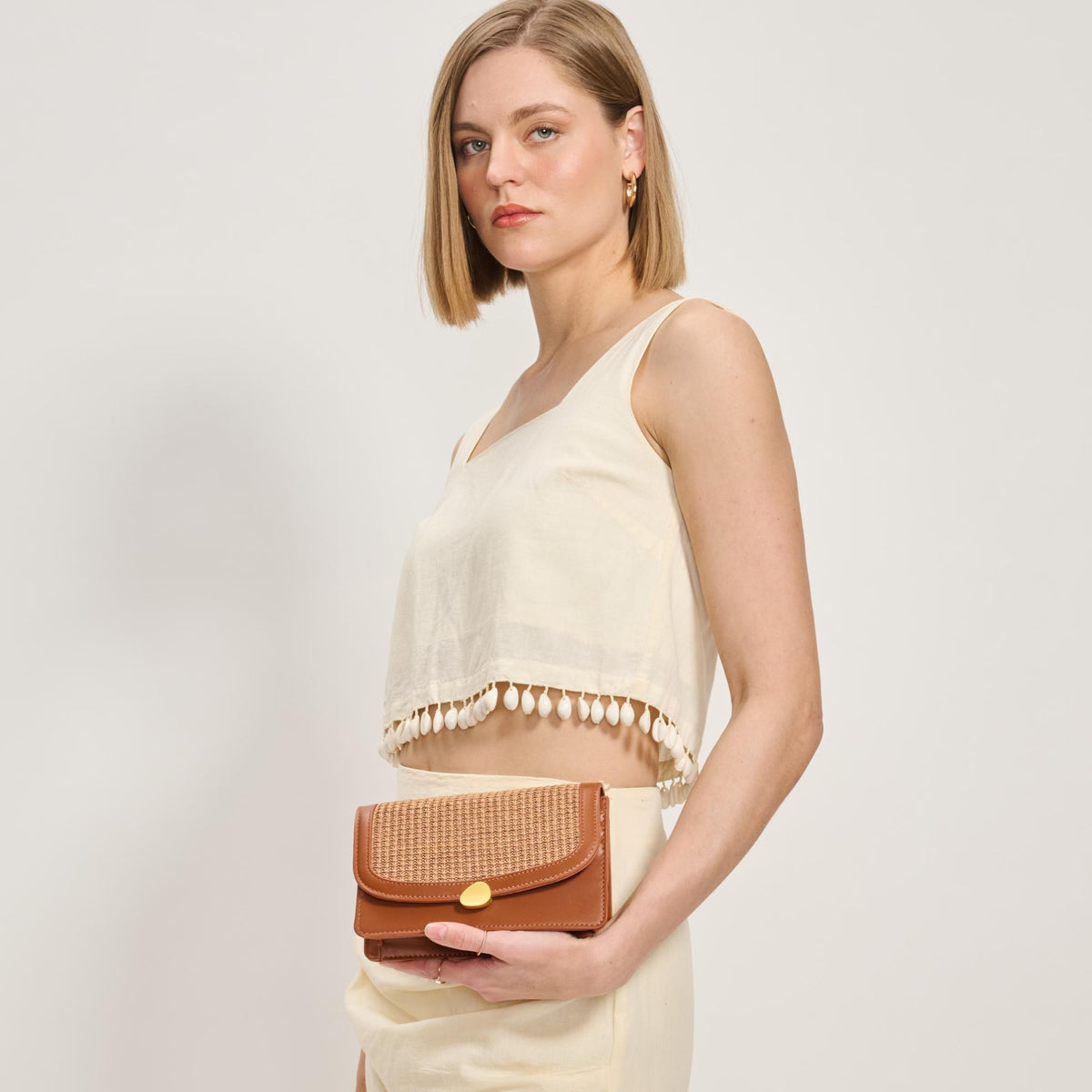 Woman wearing Tan Moda Luxe Nina Crossbody 842017137191 View 3 | Tan