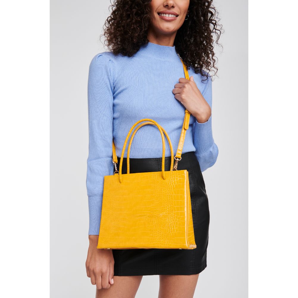 Woman wearing Mustard Moda Luxe Pierce Mini Tote 842017125853 View 1 | Mustard