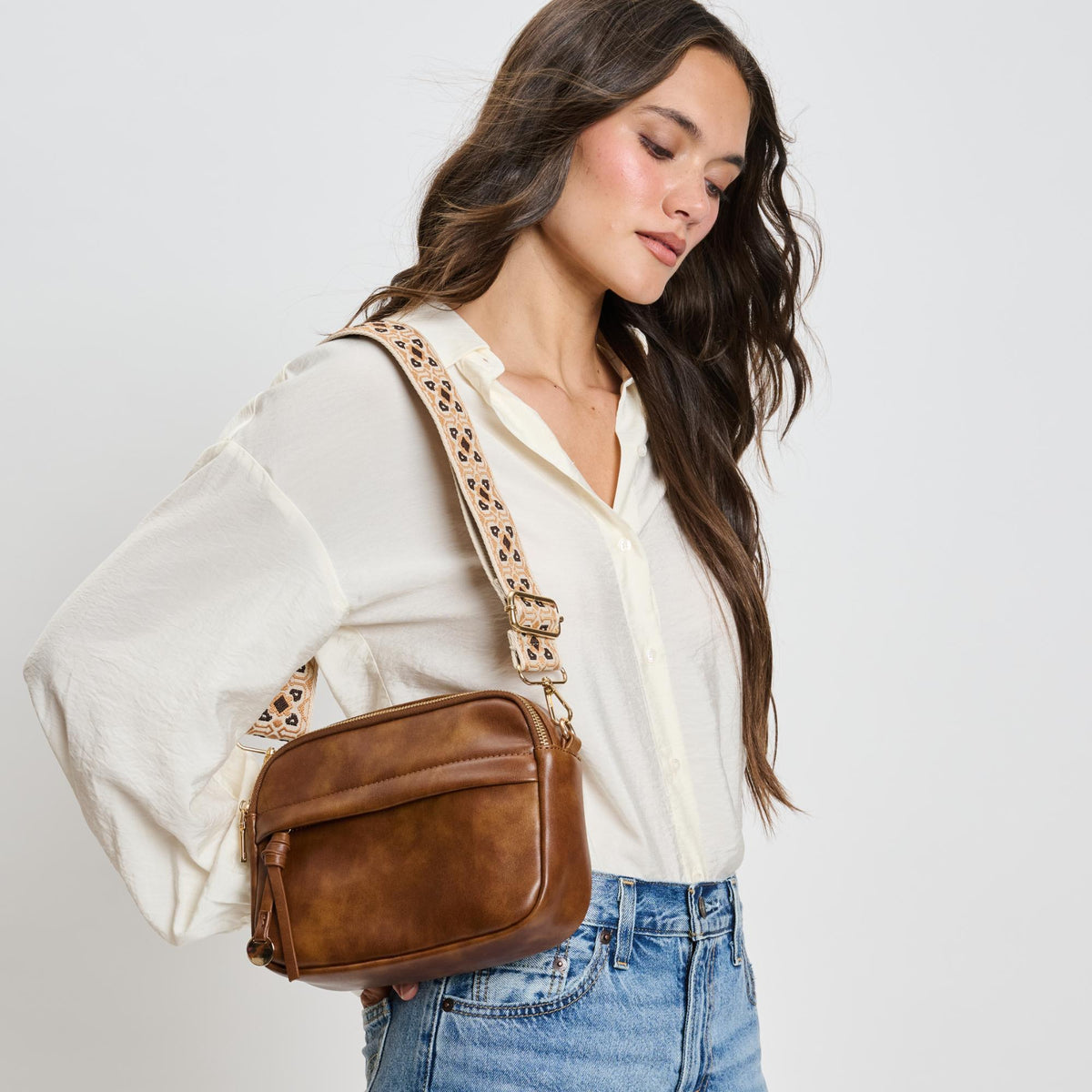 Woman wearing Cognac Moda Luxe Hannah Crossbody 842017136729 View 1 | Cognac