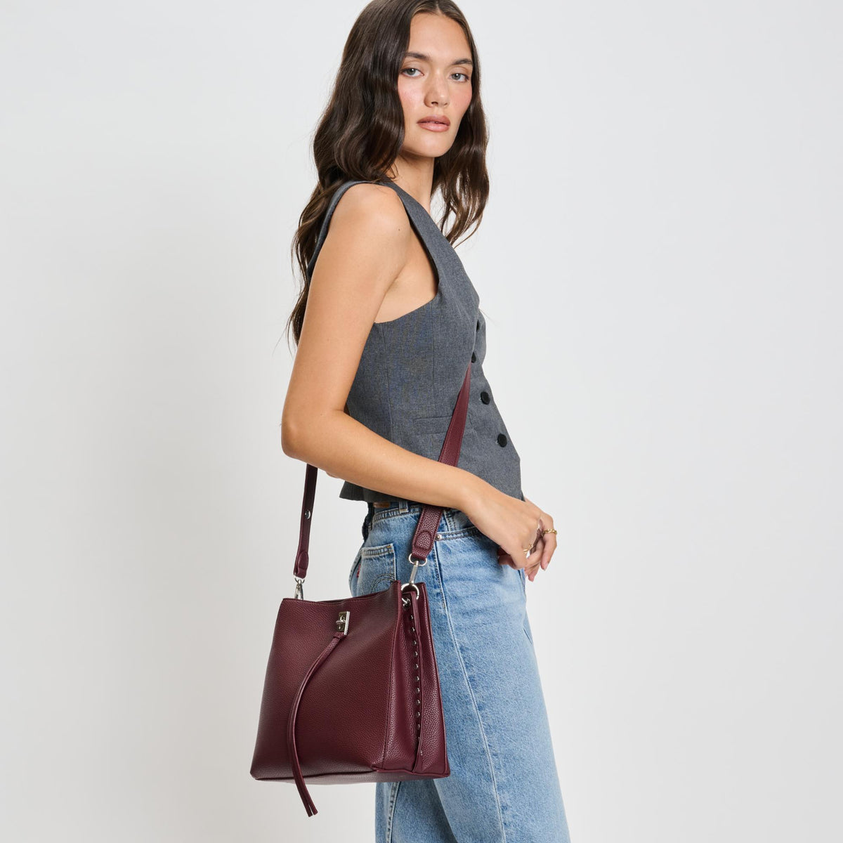 Woman wearing Wine Moda Luxe Eliza Crossbody 842017136040 View 2 | Wine