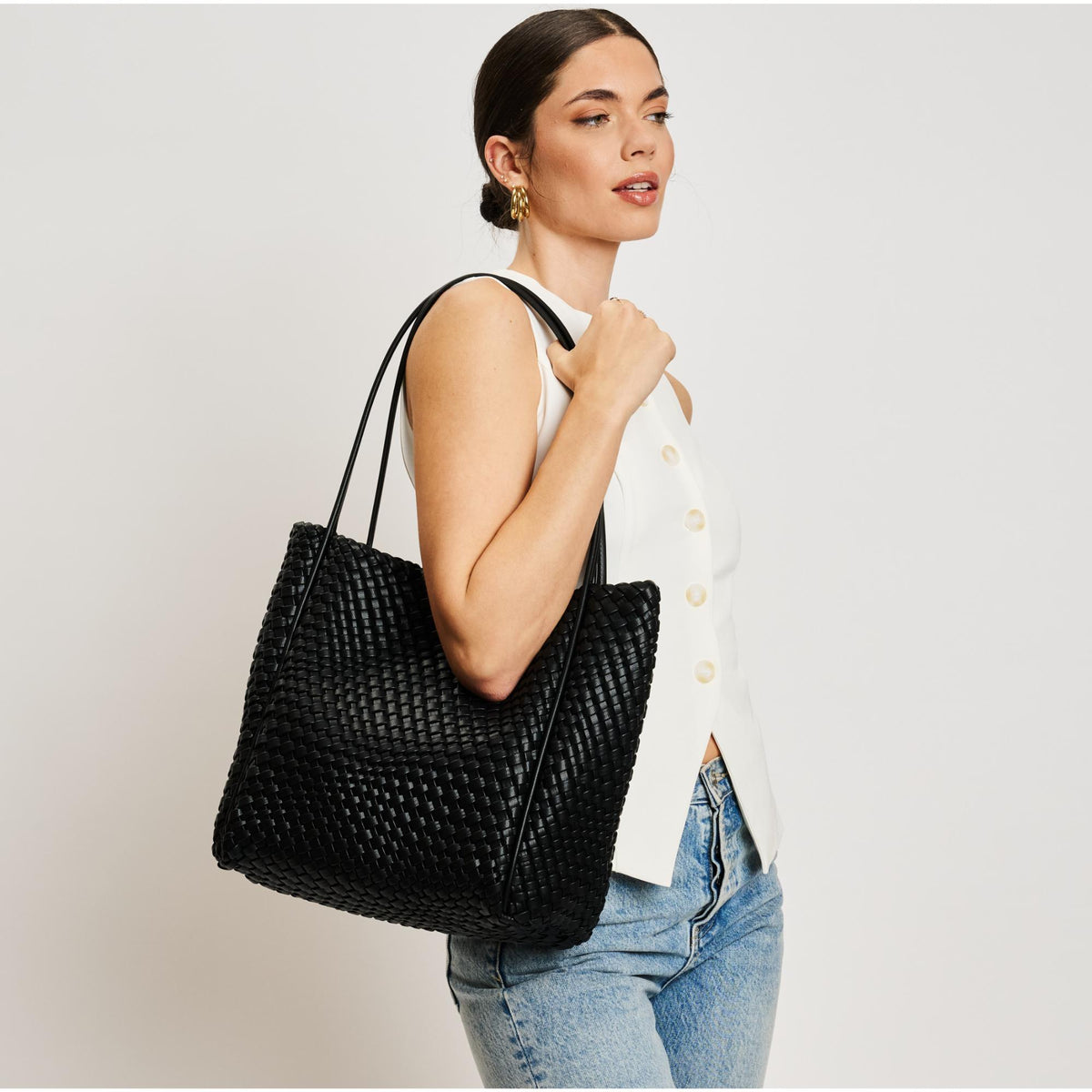 Woman wearing Black Moda Luxe Gladys Tote 842017137245 View 1 | Black