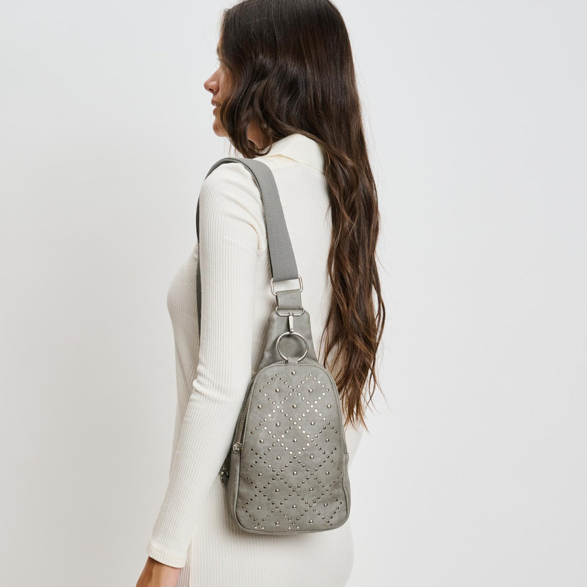 Woman wearing Grey Moda Luxe Regina Studded Sling Backpack 842017136811 View 2 | Grey