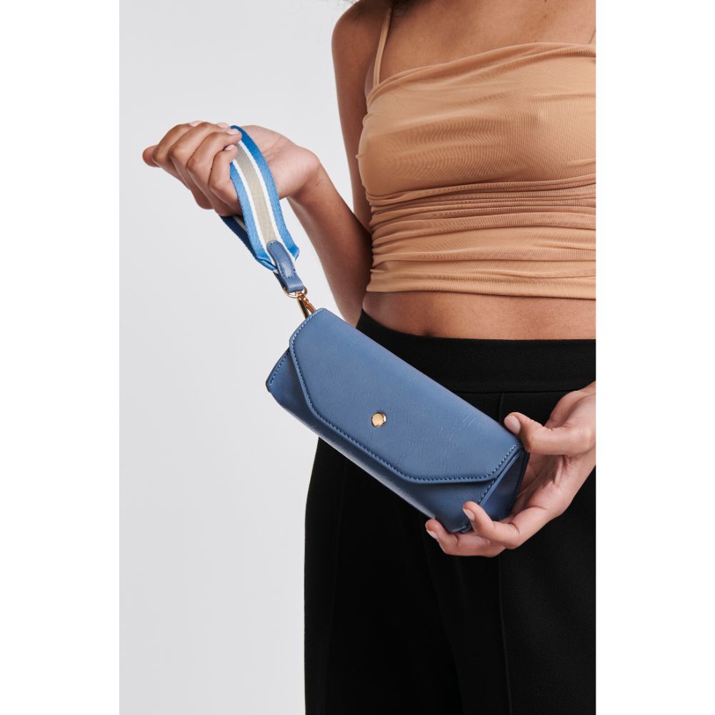 Woman wearing Blue Moda Luxe Kaya Wristlet 842017126959 View 1 | Blue