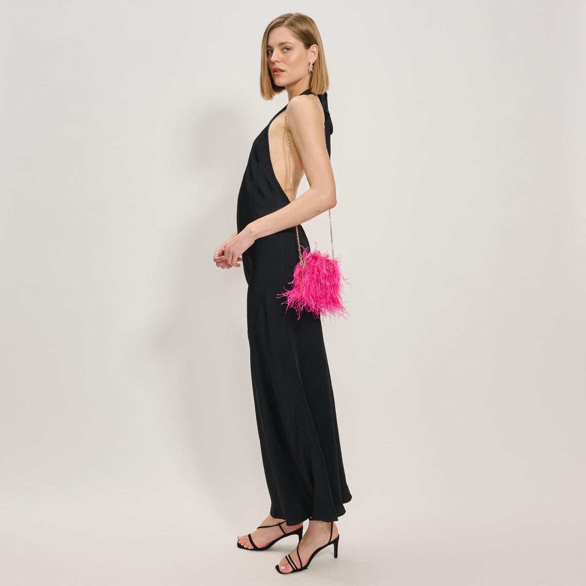 Woman wearing Hot Pink Moda Luxe Feathered Flair Evening Bag 842017138822 View 4 | Hot Pink