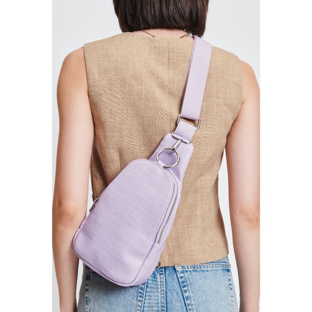 Woman wearing Lavender Moda Luxe Regina - Coated Canvas Sling Backpack 842017132622 View 4 | Lavender