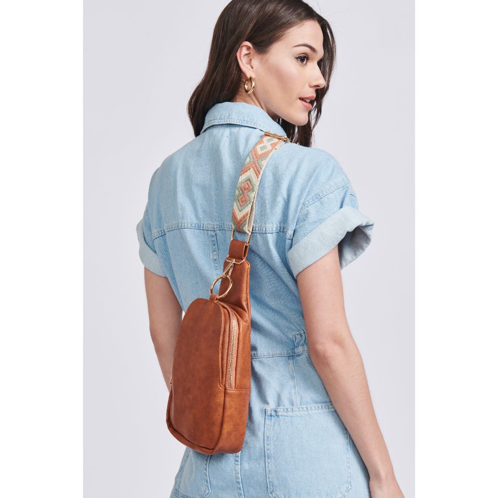 Woman wearing Tan Moda Luxe Regina Sling Backpack 842017129547 View 3 | Tan