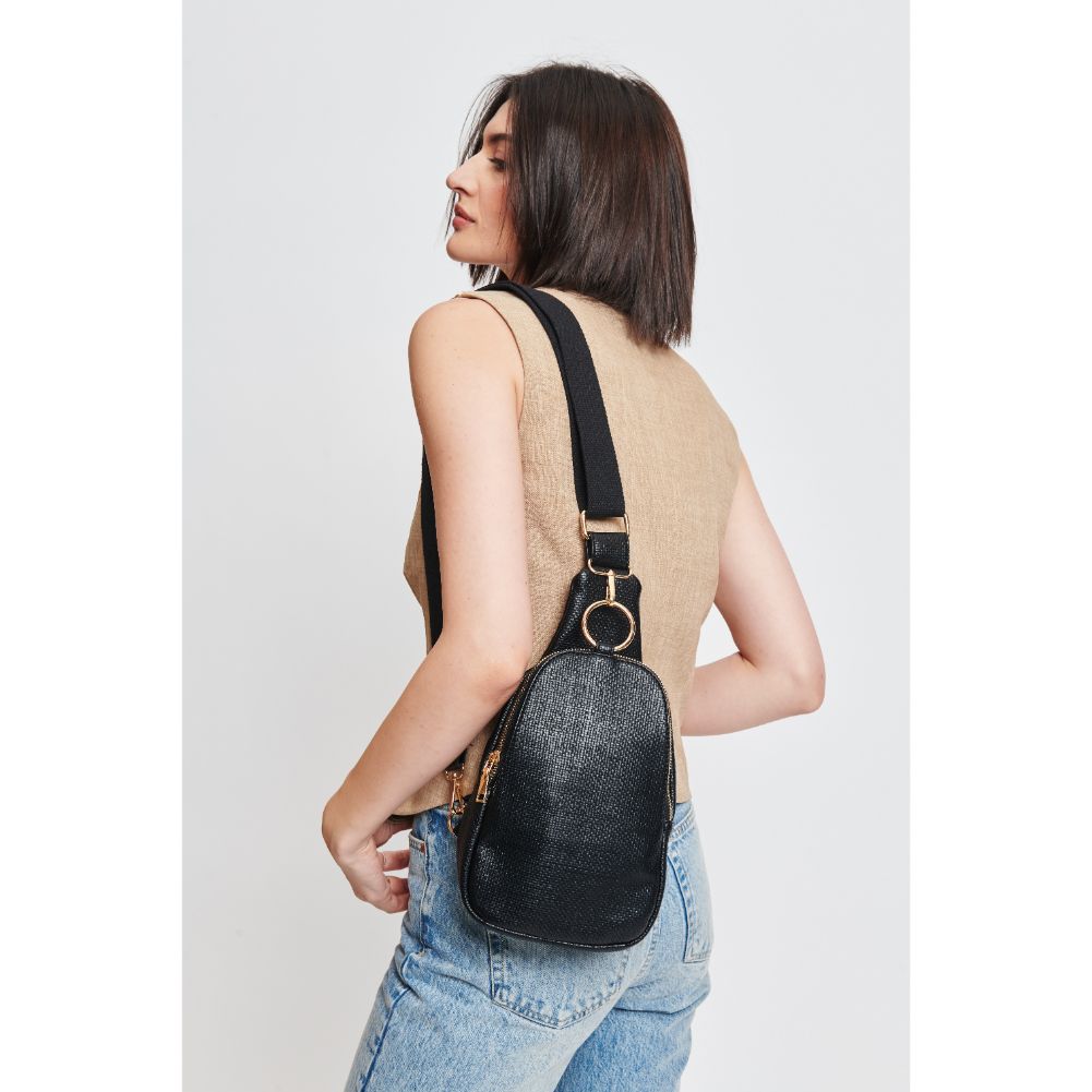 Woman wearing Black Moda Luxe Regina - Coated Canvas Sling Backpack 842017132592 View 2 | Black