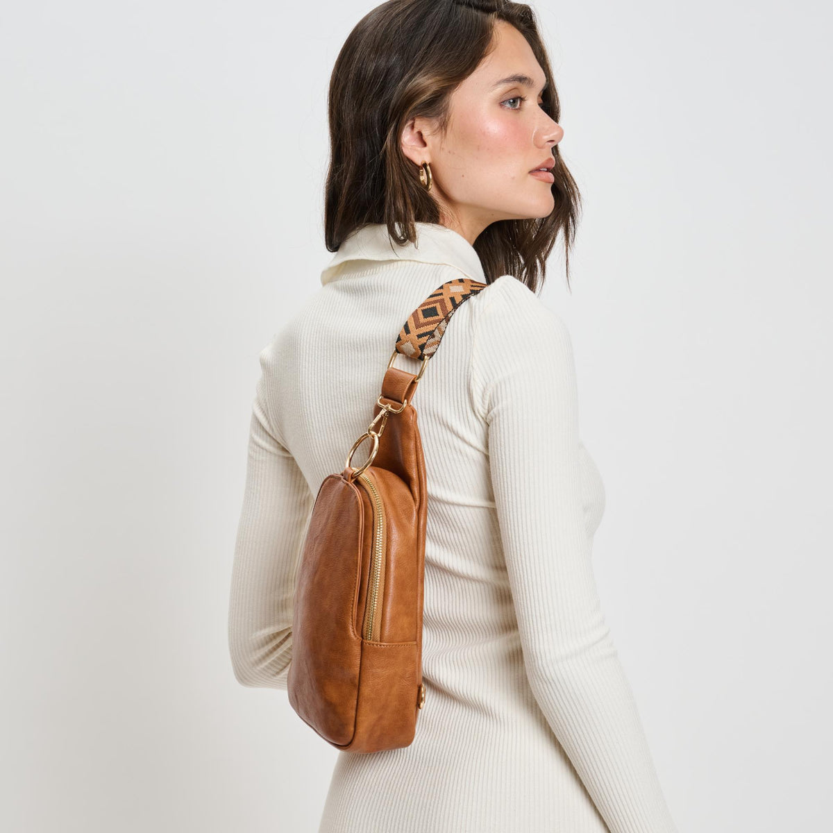 Woman wearing Cognac Moda Luxe Regina Sling Backpack 842017135975 View 3 | Cognac