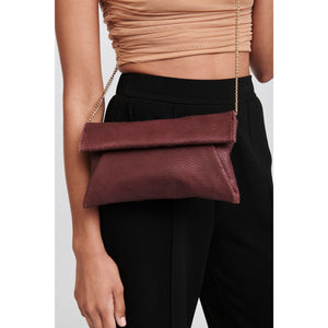 Woman wearing Burgundy Moda Luxe Audrey Clutch 842017118114 View 1 | Burgundy