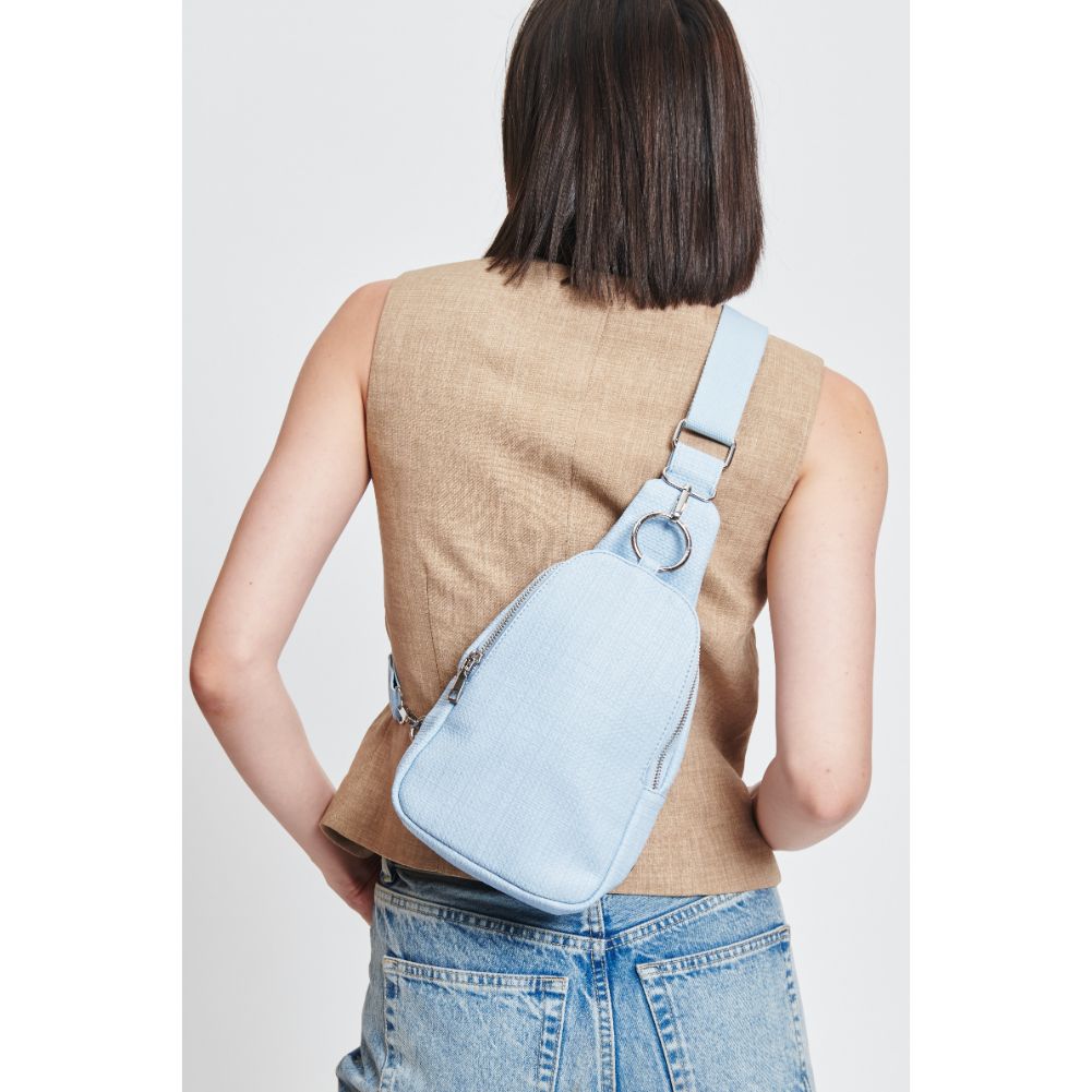 Woman wearing Sky Blue Moda Luxe Regina - Coated Canvas Sling Backpack 842017132608 View 4 | Sky Blue