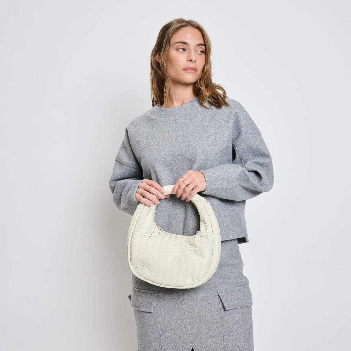 Woman wearing Oatmilk Moda Luxe Cassidy Clutch 842017136354 View 1 | Oatmilk