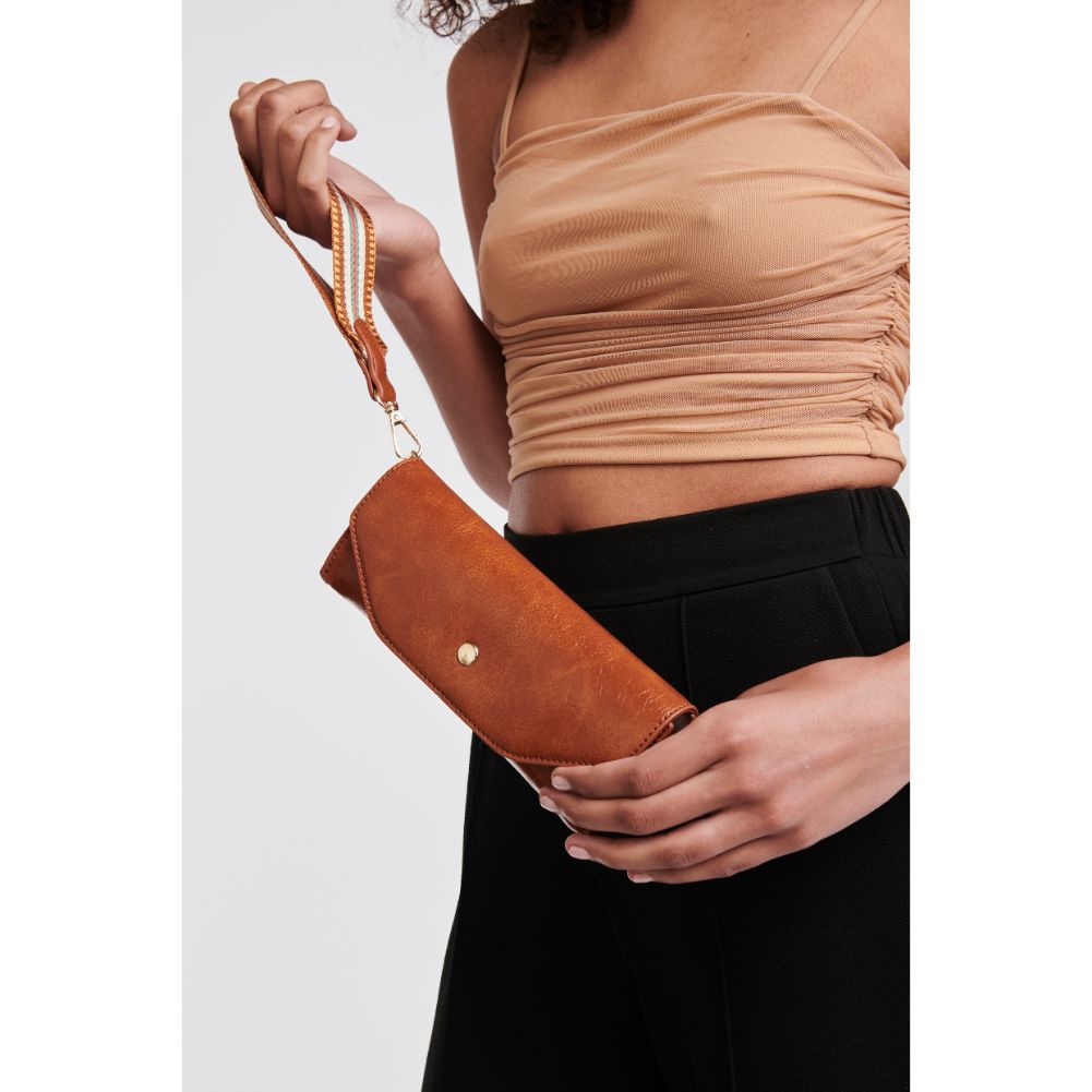 Woman wearing Tan Moda Luxe Kaya Wristlet 842017126928 View 1 | Tan