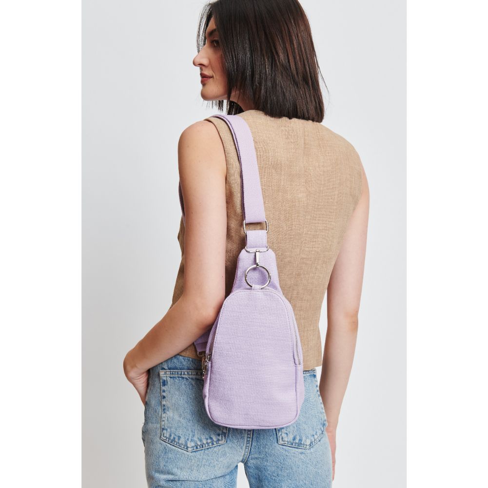 Woman wearing Lavender Moda Luxe Regina - Coated Canvas Sling Backpack 842017132622 View 1 | Lavender