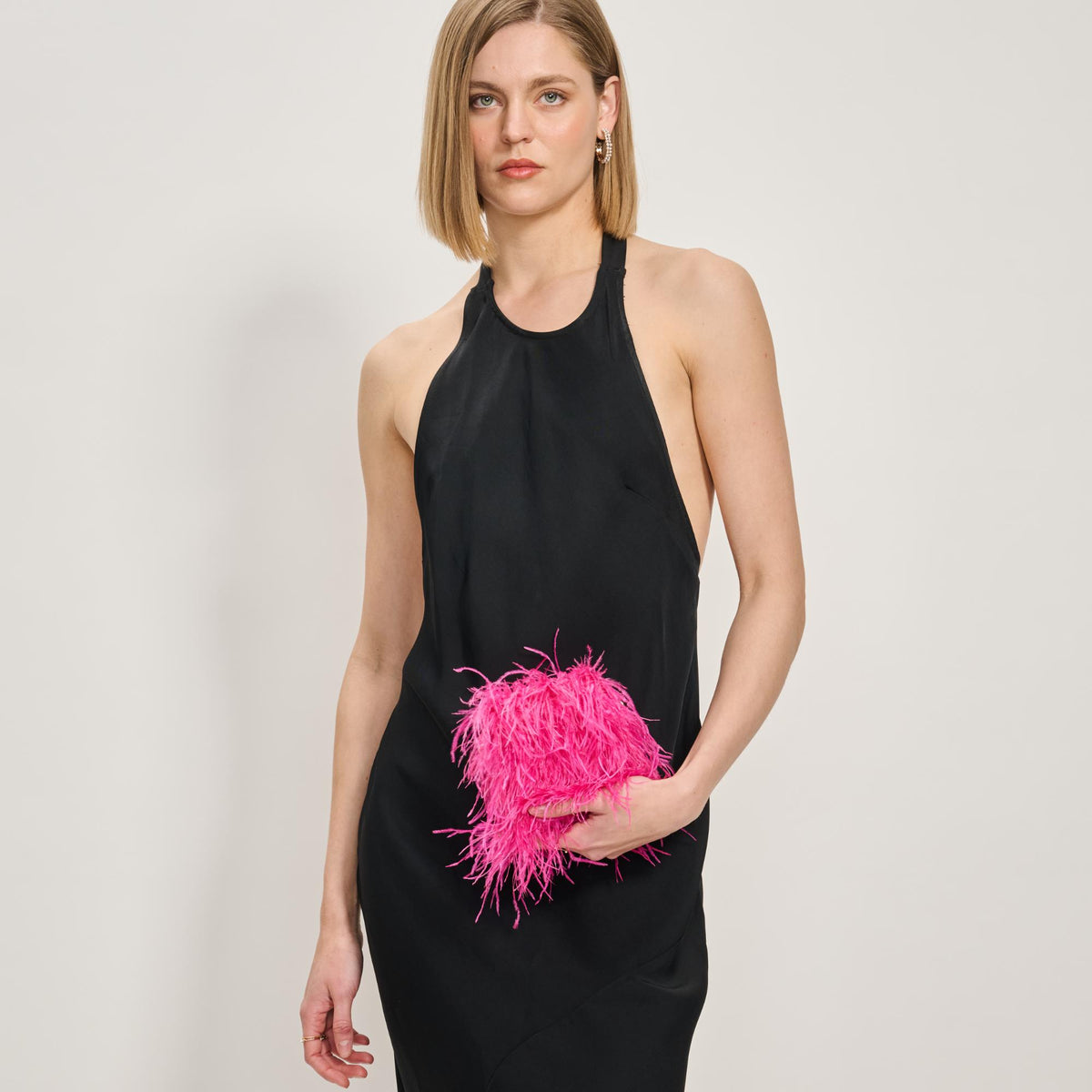 Woman wearing Hot Pink Moda Luxe Feathered Flair Evening Bag 842017138822 View 2 | Hot Pink