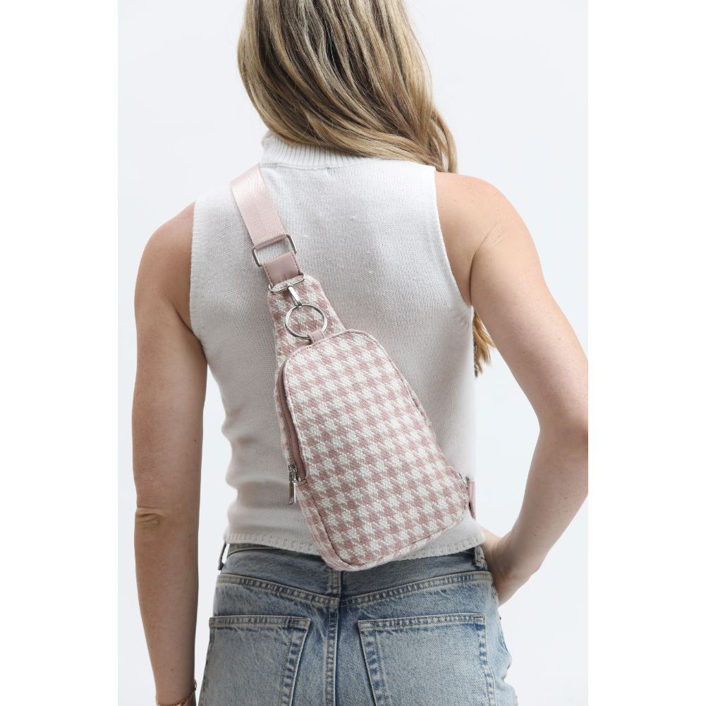 Woman wearing Pink White Moda Luxe Regina Sling Backpack 842017133377 View 2 | Pink White