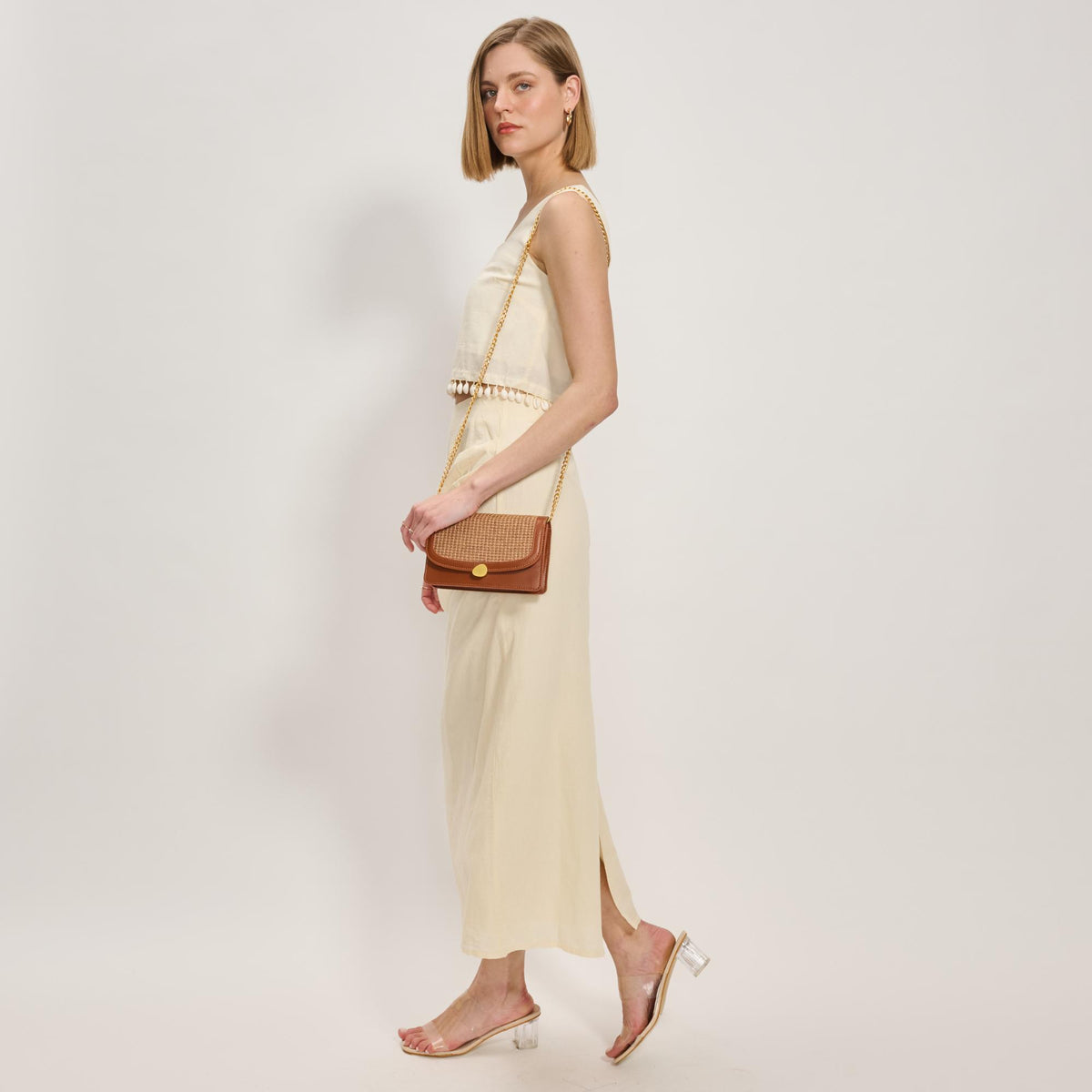 Woman wearing Tan Moda Luxe Nina Crossbody 842017137191 View 2 | Tan