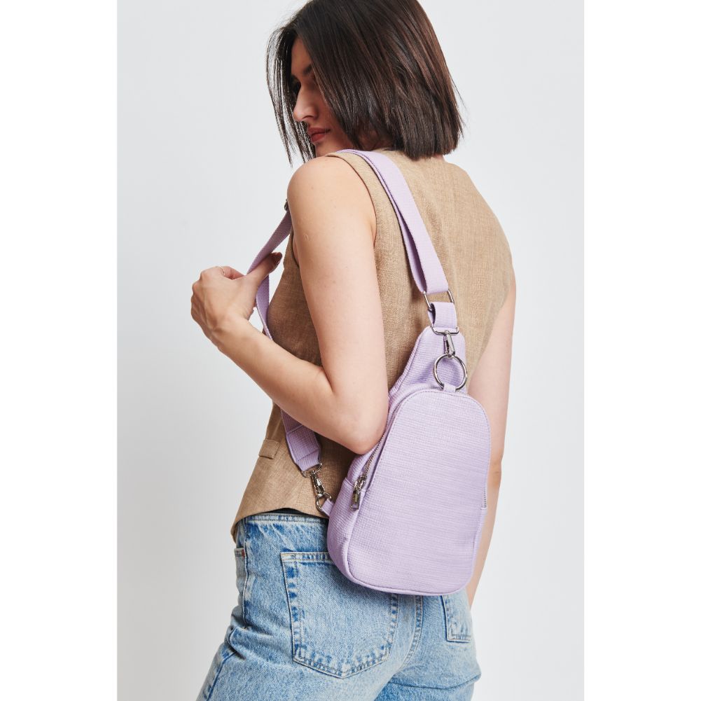 Woman wearing Lavender Moda Luxe Regina - Coated Canvas Sling Backpack 842017132622 View 2 | Lavender