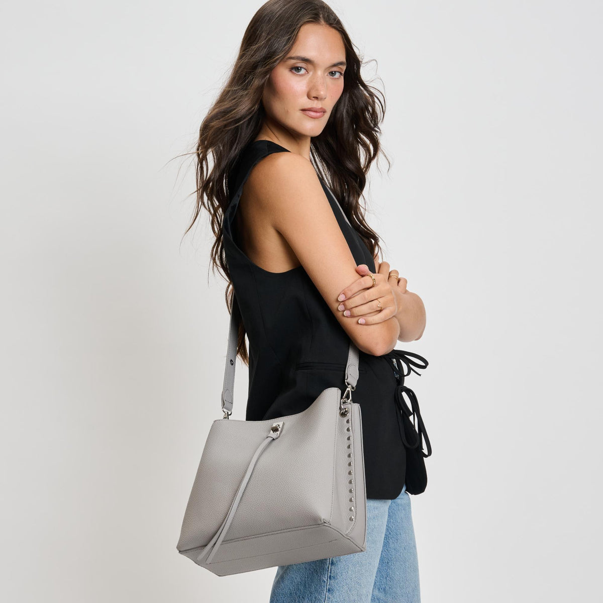 Woman wearing Grey Moda Luxe Eliza Crossbody 842017136057 View 1 | Grey