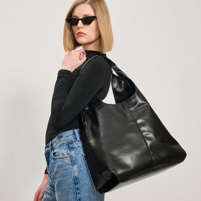 Woman wearing Black Moda Luxe Faye Hobo 842017138754 View 1 | Black