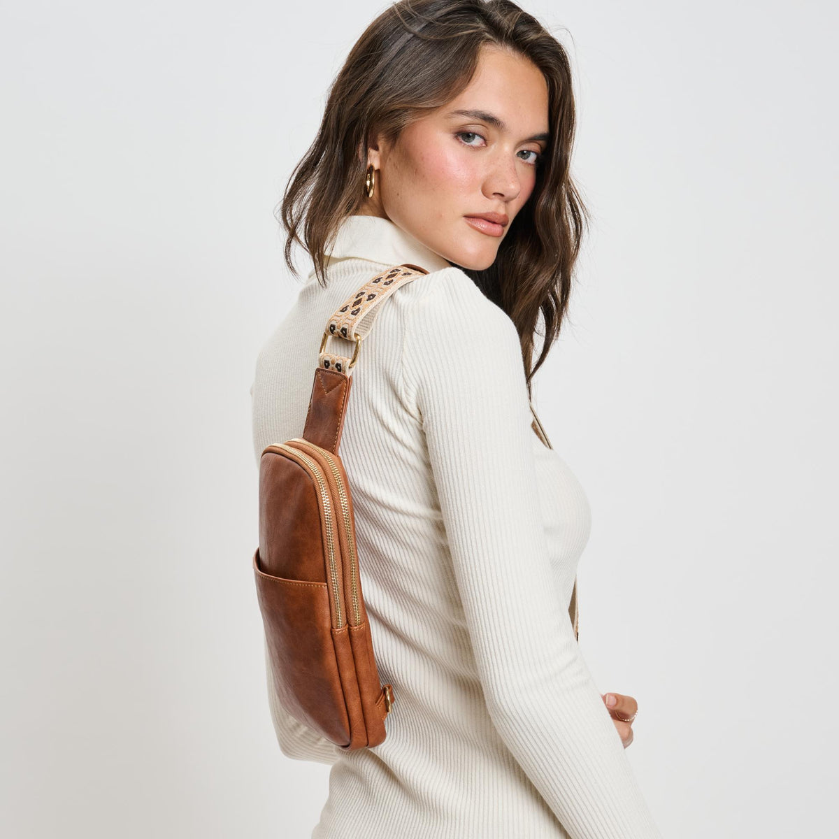 Woman wearing Tan Moda Luxe Zuri Sling Backpack 842017135845 View 3 | Tan