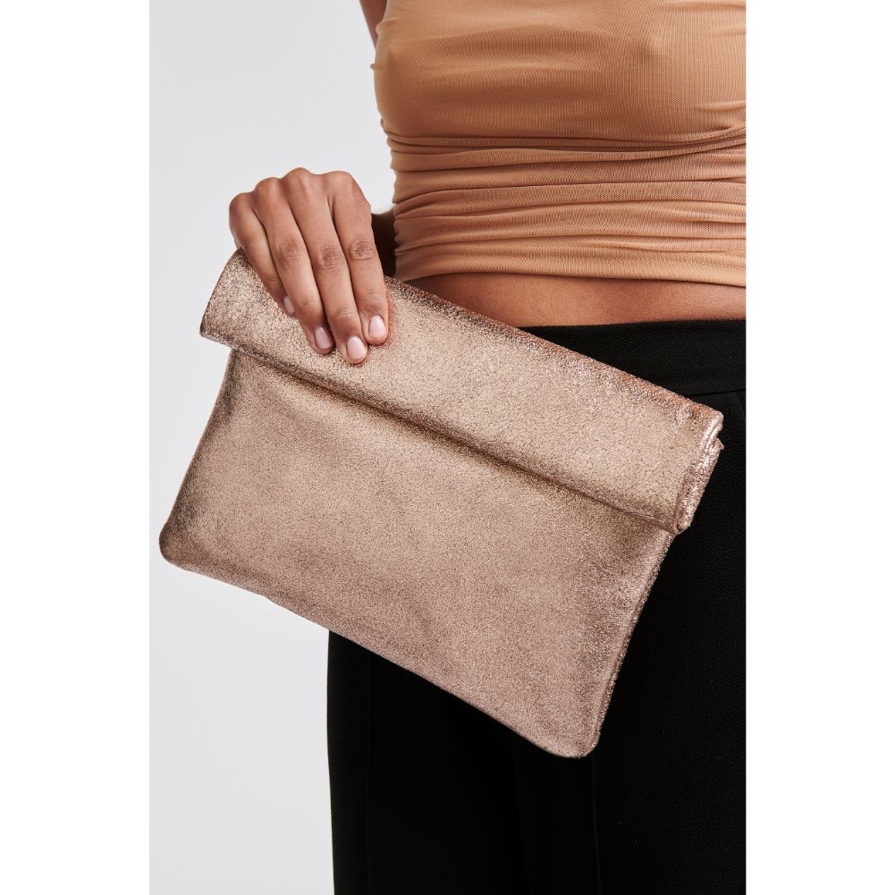 Woman wearing Rose Gold Moda Luxe Gianna Metallic Clutch 842017110798 View 1 | Rose Gold