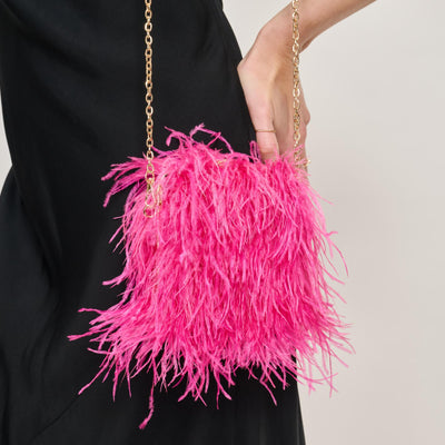 Woman wearing Hot Pink Moda Luxe Feathered Flair Evening Bag 842017138822 View 1 | Hot Pink