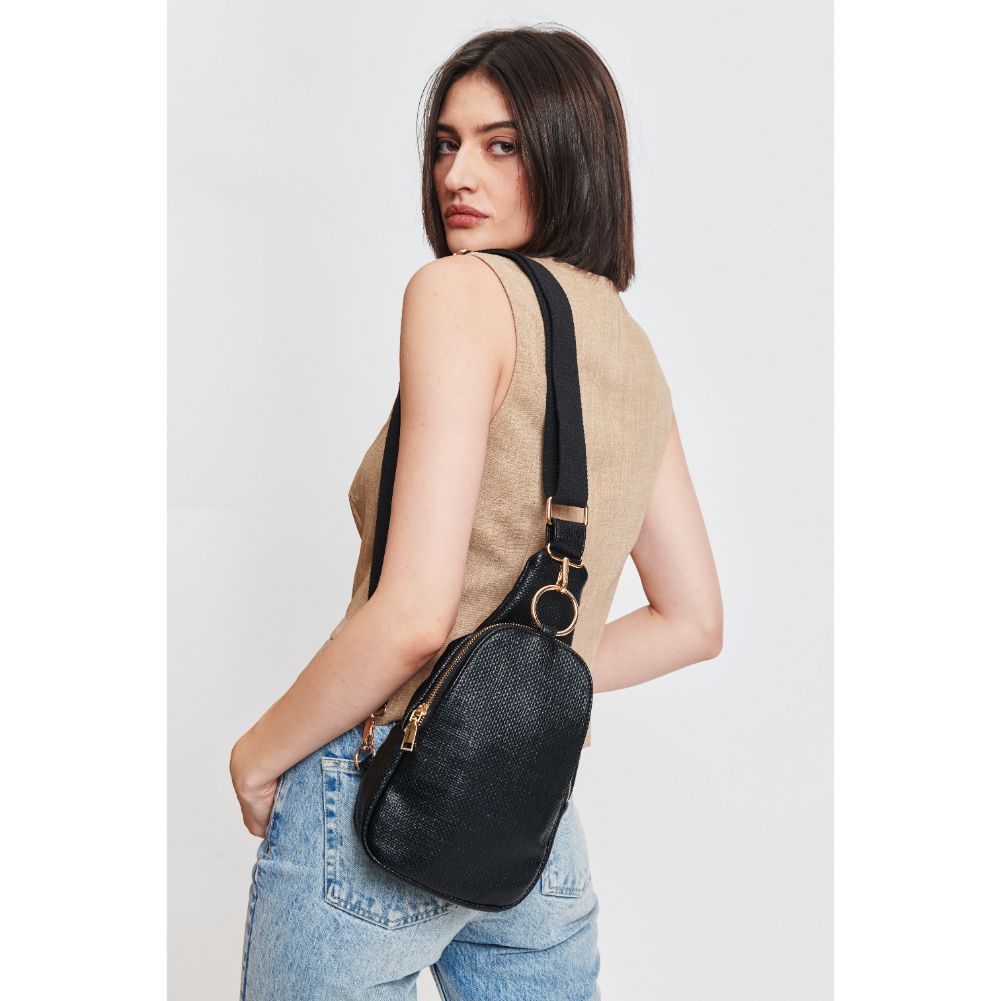 Woman wearing Black Moda Luxe Regina - Coated Canvas Sling Backpack 842017132592 View 1 | Black