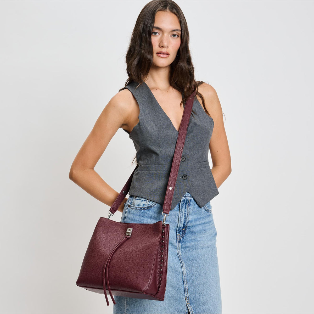 Woman wearing Wine Moda Luxe Eliza Crossbody 842017136040 View 1 | Wine