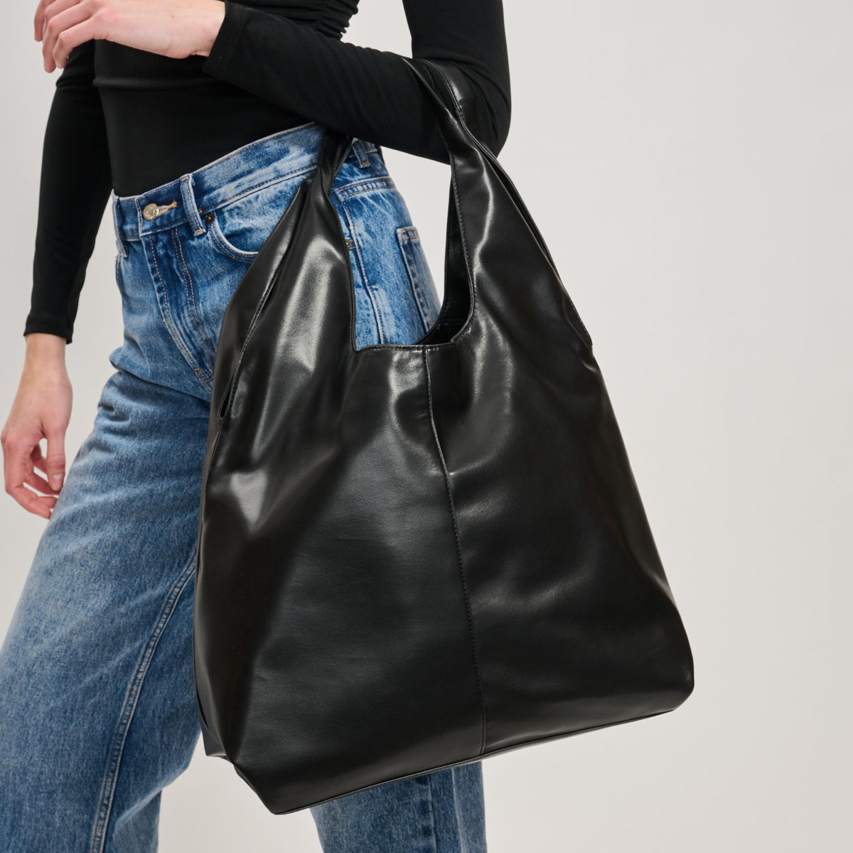 Woman wearing Black Moda Luxe Faye Hobo 842017138754 View 4 | Black