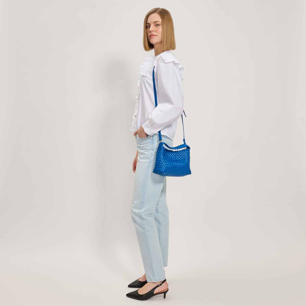 Woman wearing Electric Blue Moda Luxe Kaia Crossbody 842017137429 View 3 | Electric Blue