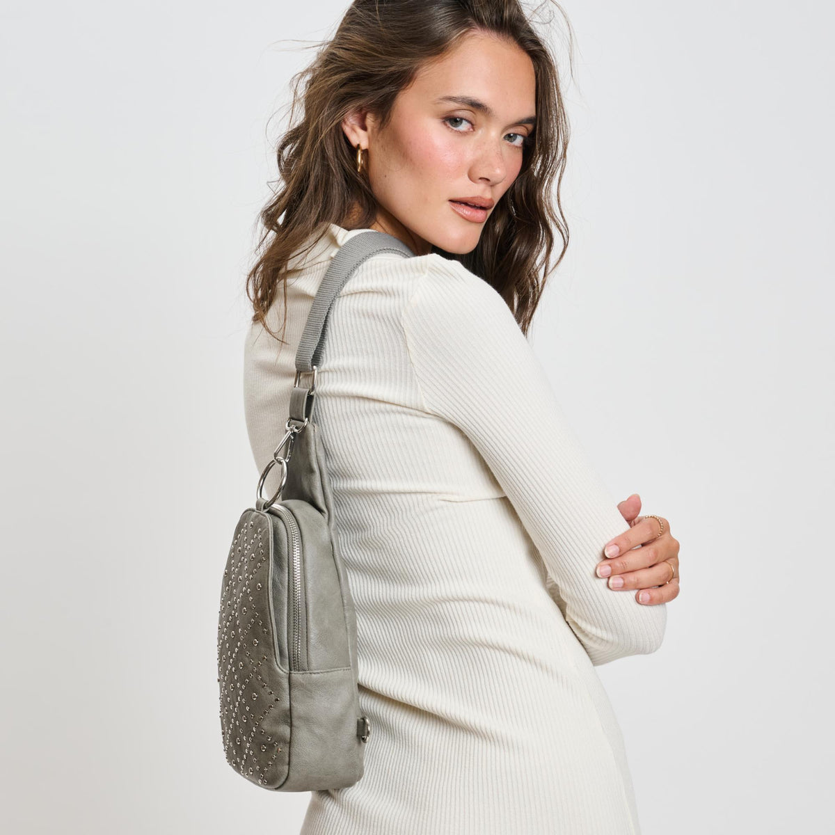 Woman wearing Grey Moda Luxe Regina Studded Sling Backpack 842017136811 View 3 | Grey