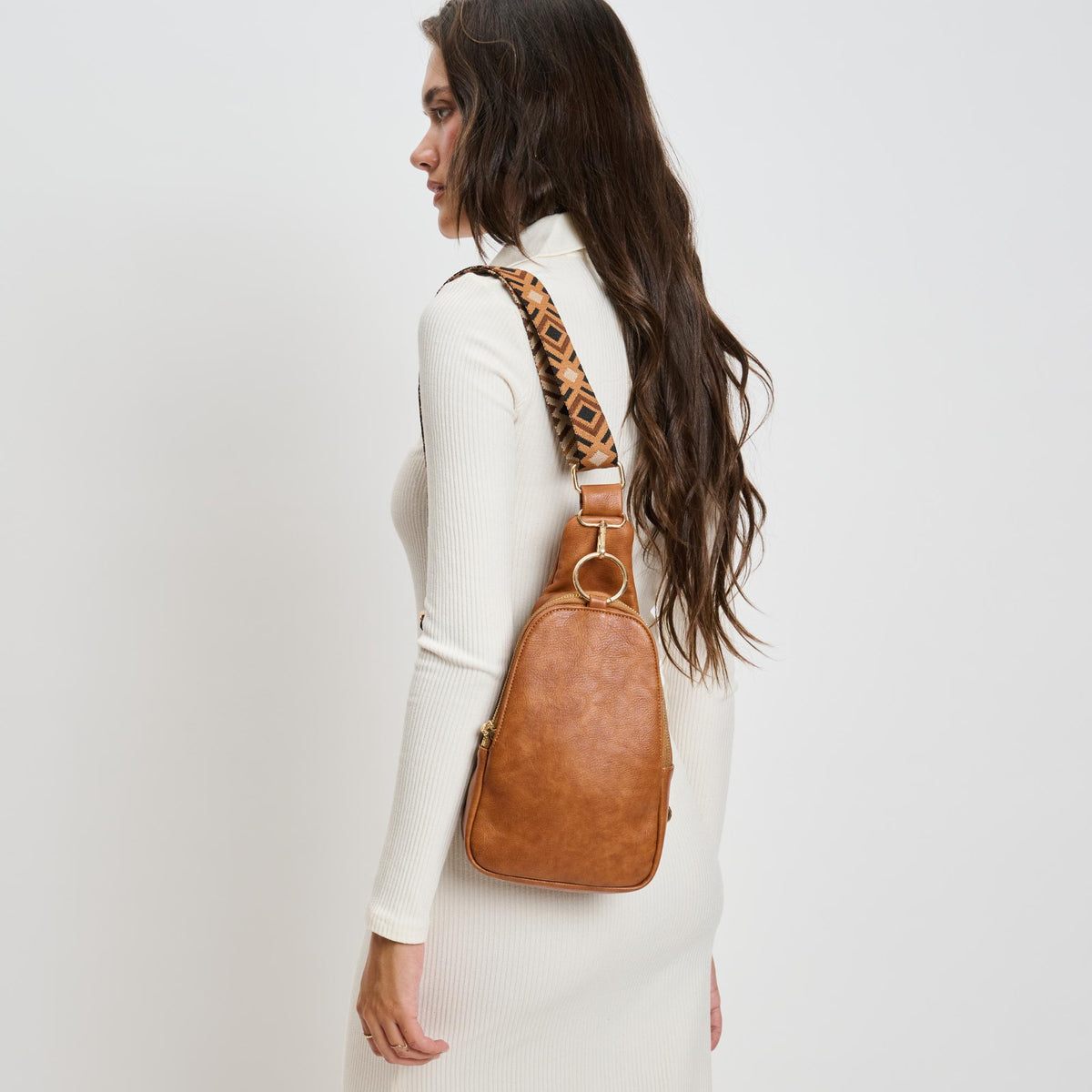 Woman wearing Cognac Moda Luxe Regina Sling Backpack 842017135975 View 2 | Cognac