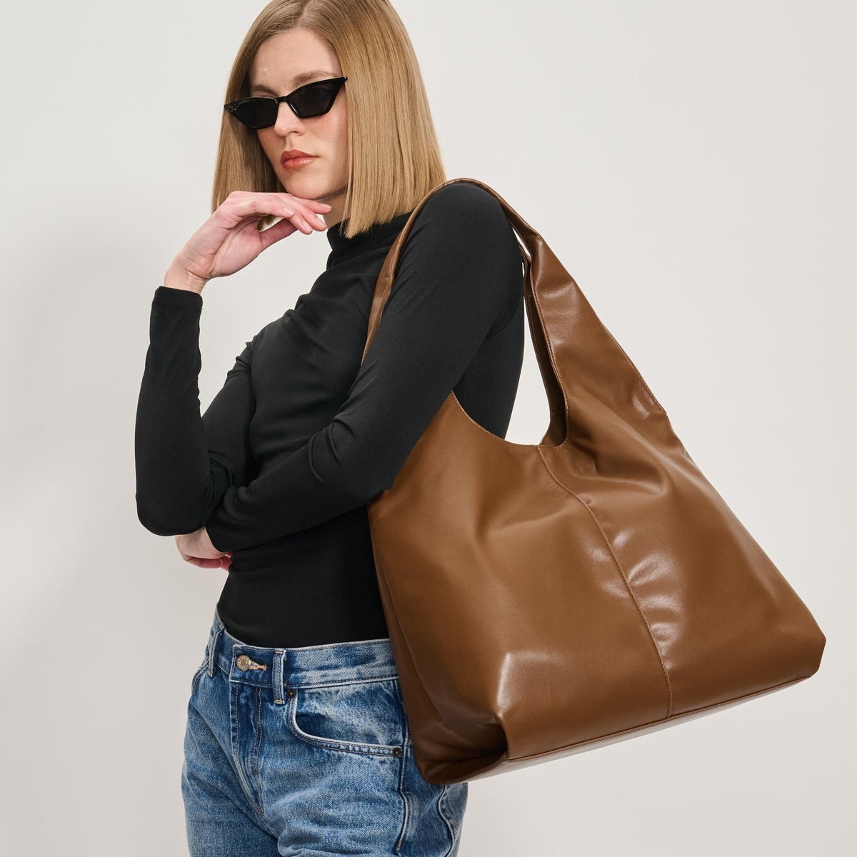 Woman wearing Chocolate Moda Luxe Faye Hobo 842017138785 View 1 | Chocolate