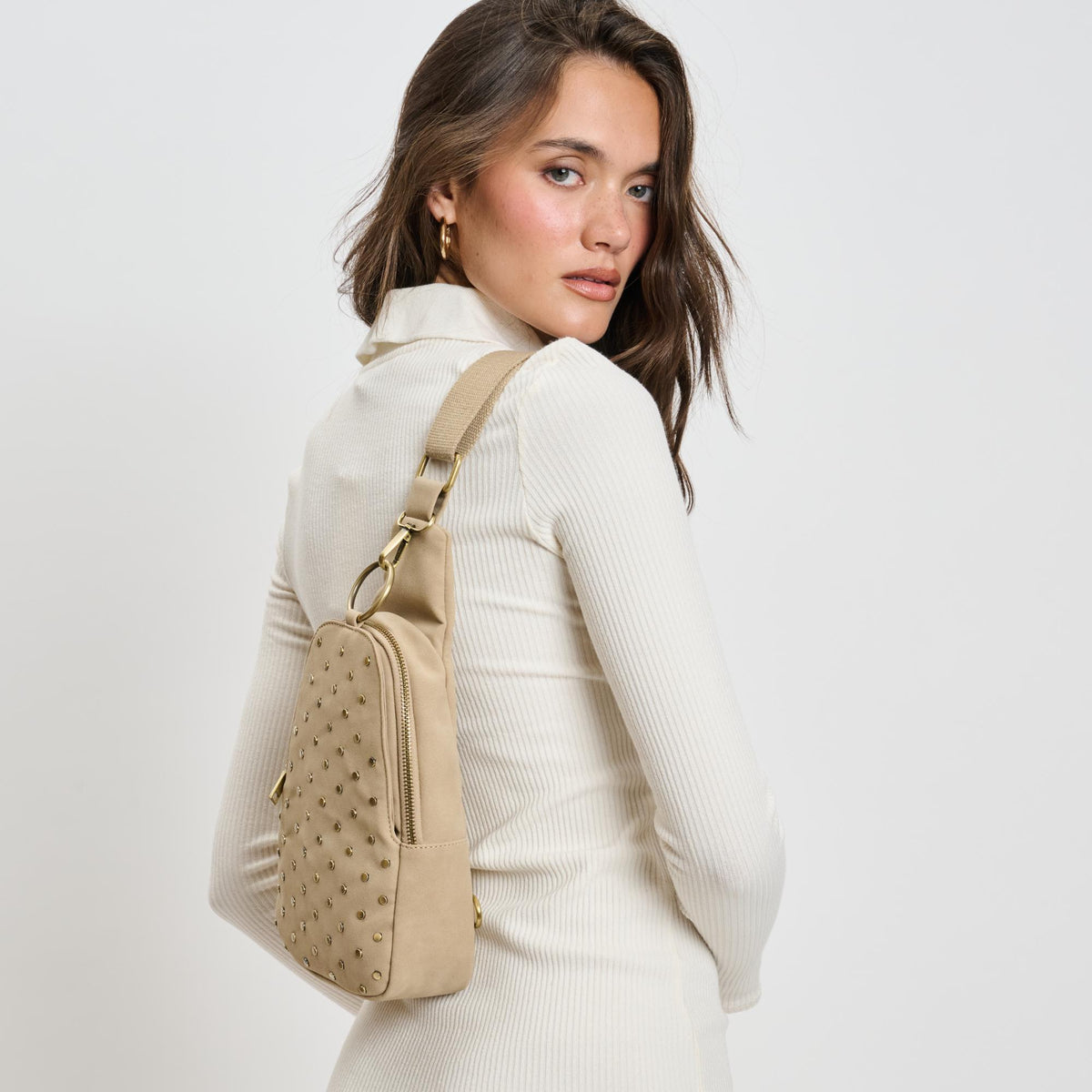 Woman wearing Natural Moda Luxe Regina Studded Sling Backpack 842017136828 View 3 | Natural