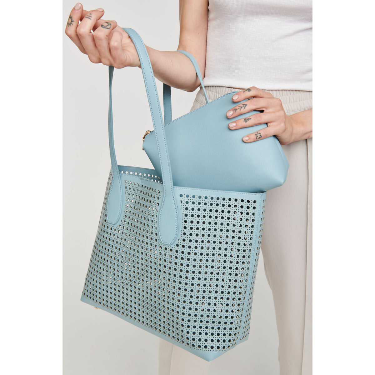 Woman wearing Eggshell Blue Moda Luxe Brazil Tote 842017124252 View 2 | Eggshell Blue