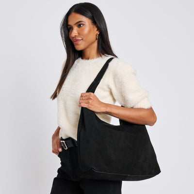 Woman wearing Black Moda Luxe Amber Hobo 842017137030 View 1 | Black