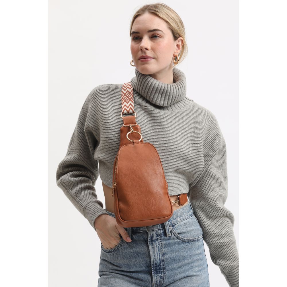 Woman wearing Tan Moda Luxe Regina Sling Backpack 842017133339 View 1 | Tan